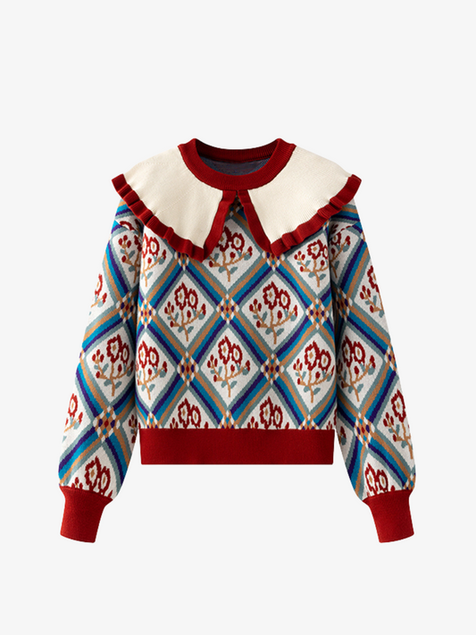 Colorful patterned sweater with a white collar on a white background