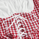 Red and white checkered dress with lace-up front on a white background