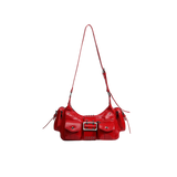 Red handbag with a gold buckle on a white background