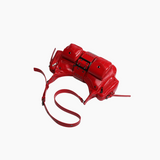 Red camera bag with a strap on a white background